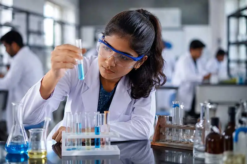 Indian student in a school science lab exploring a science-based career path